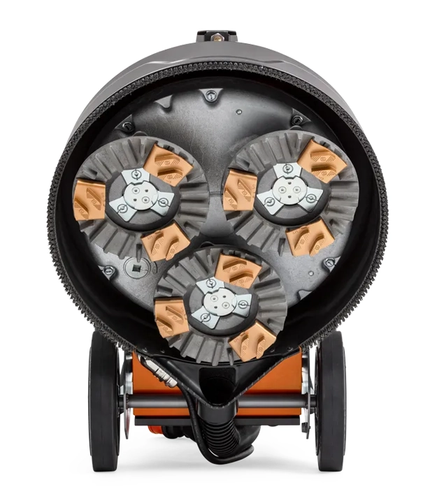 Concrete grinder showing bottom with diamonds tools